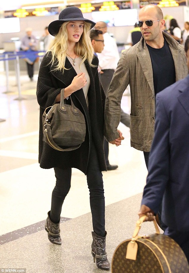 Rosie-Huntington-Whiteley-Isabel-Marant-western-boots sweater coat givenchy bag traveling