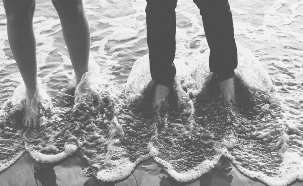 sex toy benefits for women -- man and woman's feet together in ocean