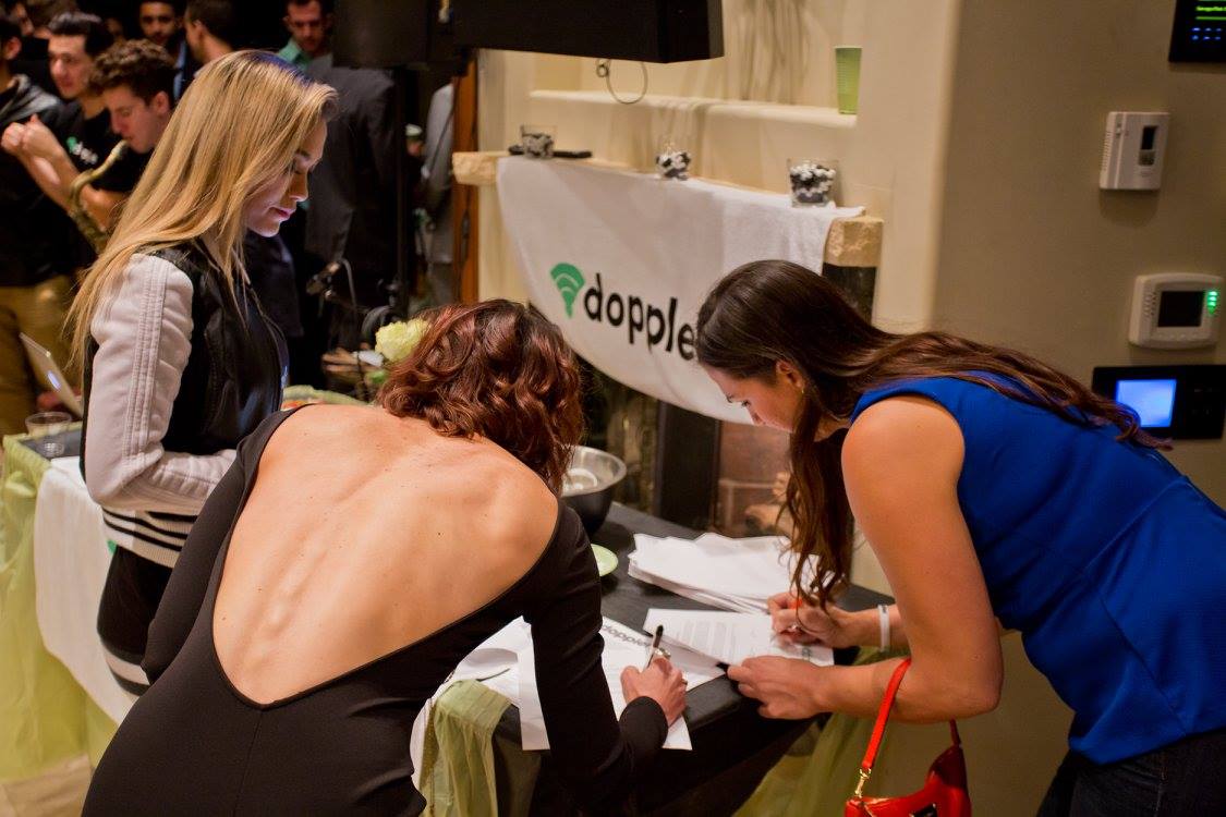 sexy girls signing up at a launch party