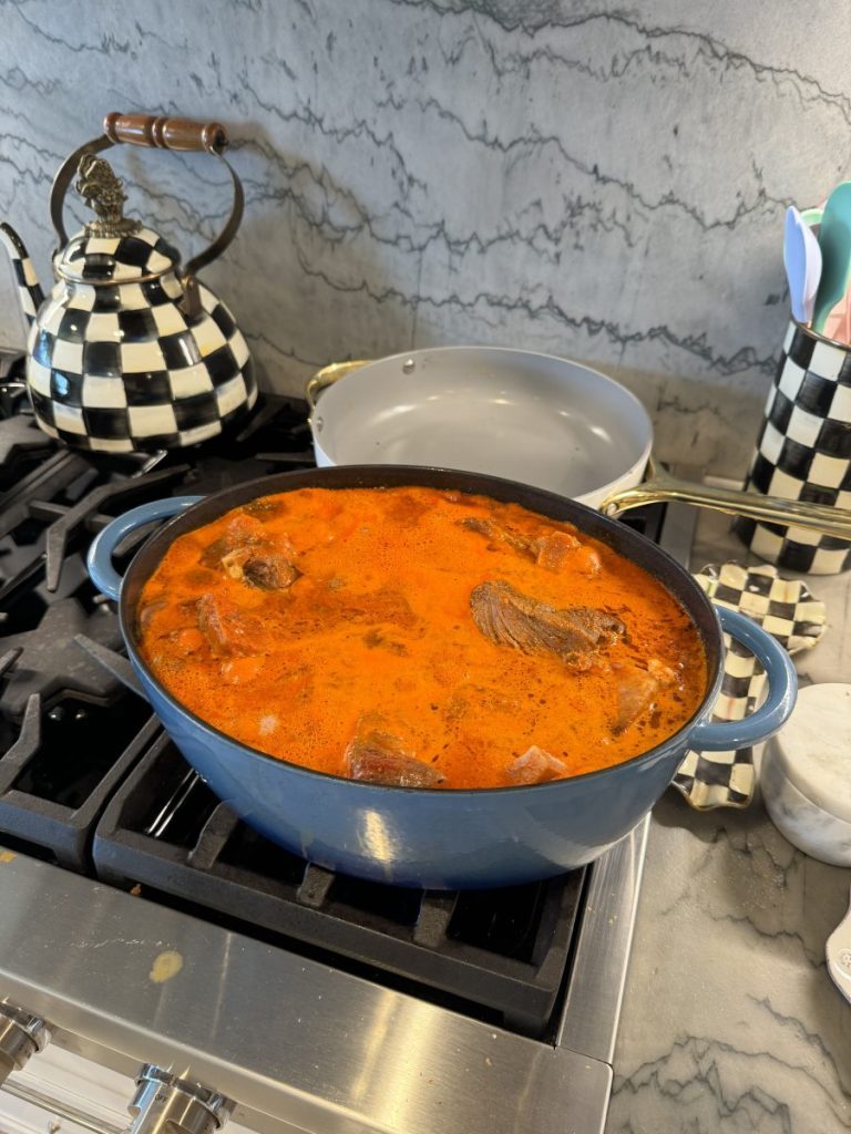 Pot of birria in homemade Chile sauce