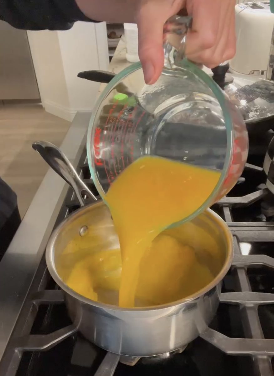 making orange fruit snack gummies on stove