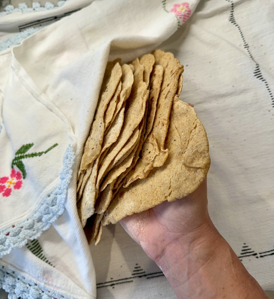 stack of flour tortillas with Mexican cloth