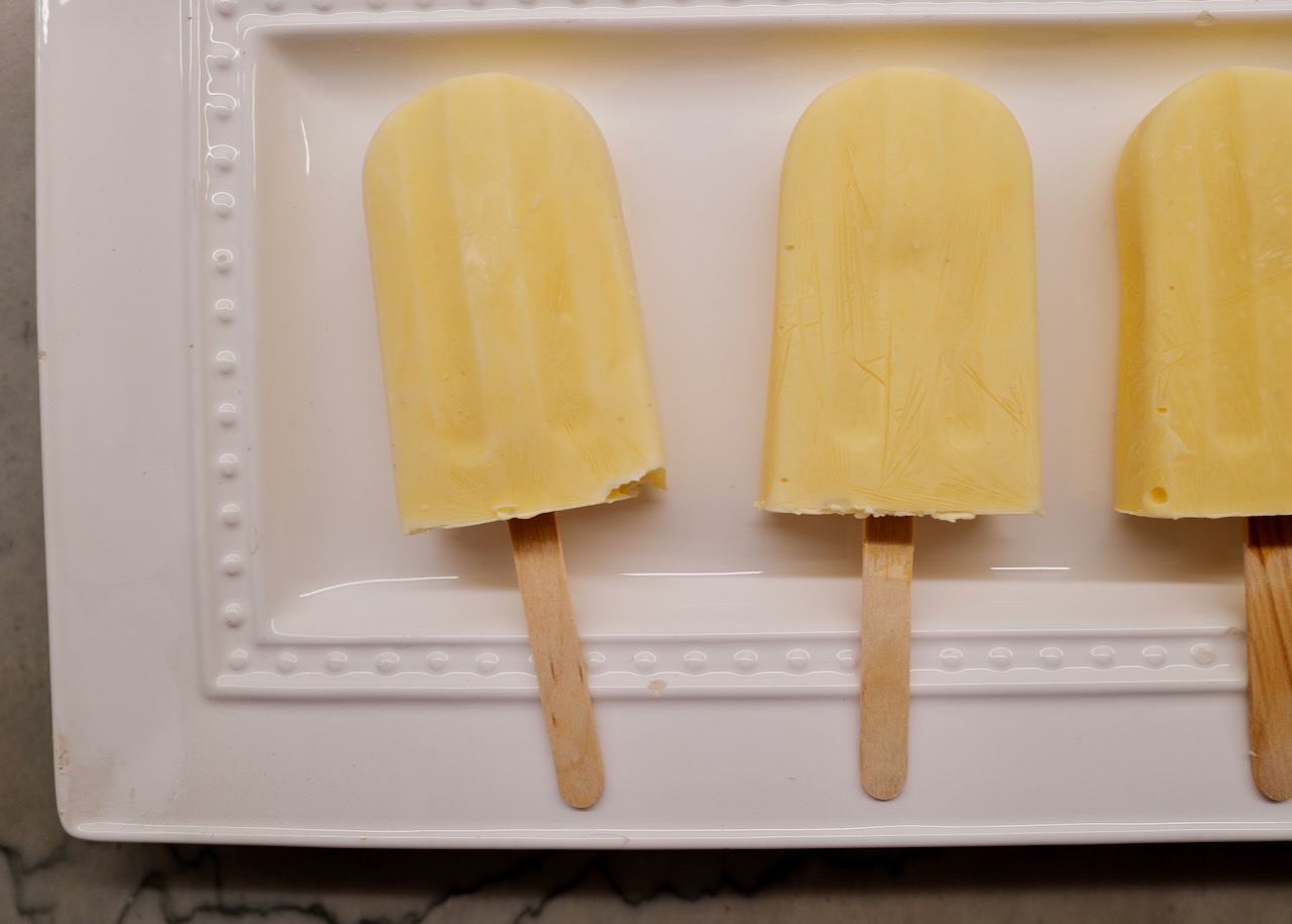 lemon popsicles on white plate