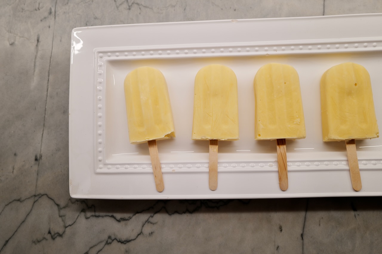 probiotic lemon popsicles on white plate