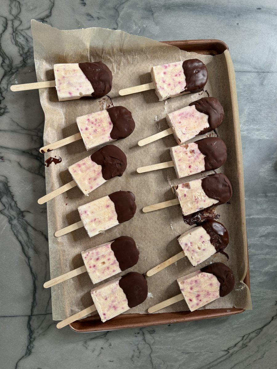 peach popsicles on baking sheet