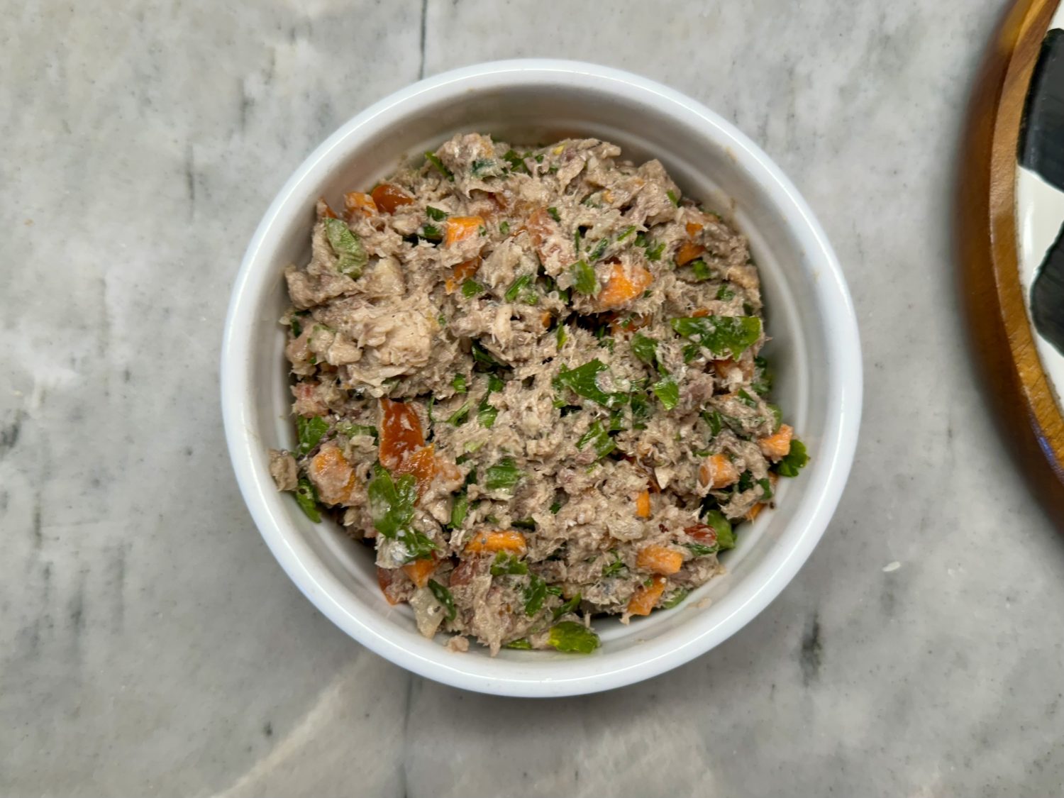 sardine salad in white bowl