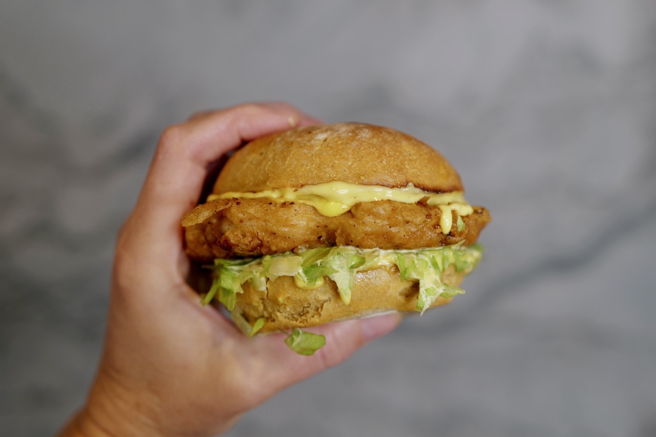 healthy mcchicken sandwich - closeup in hand