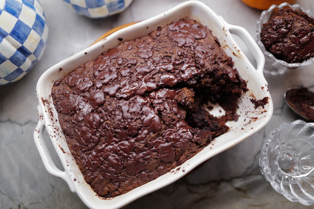 cake pumpkin brownies in a white casserole dish - halloween decor