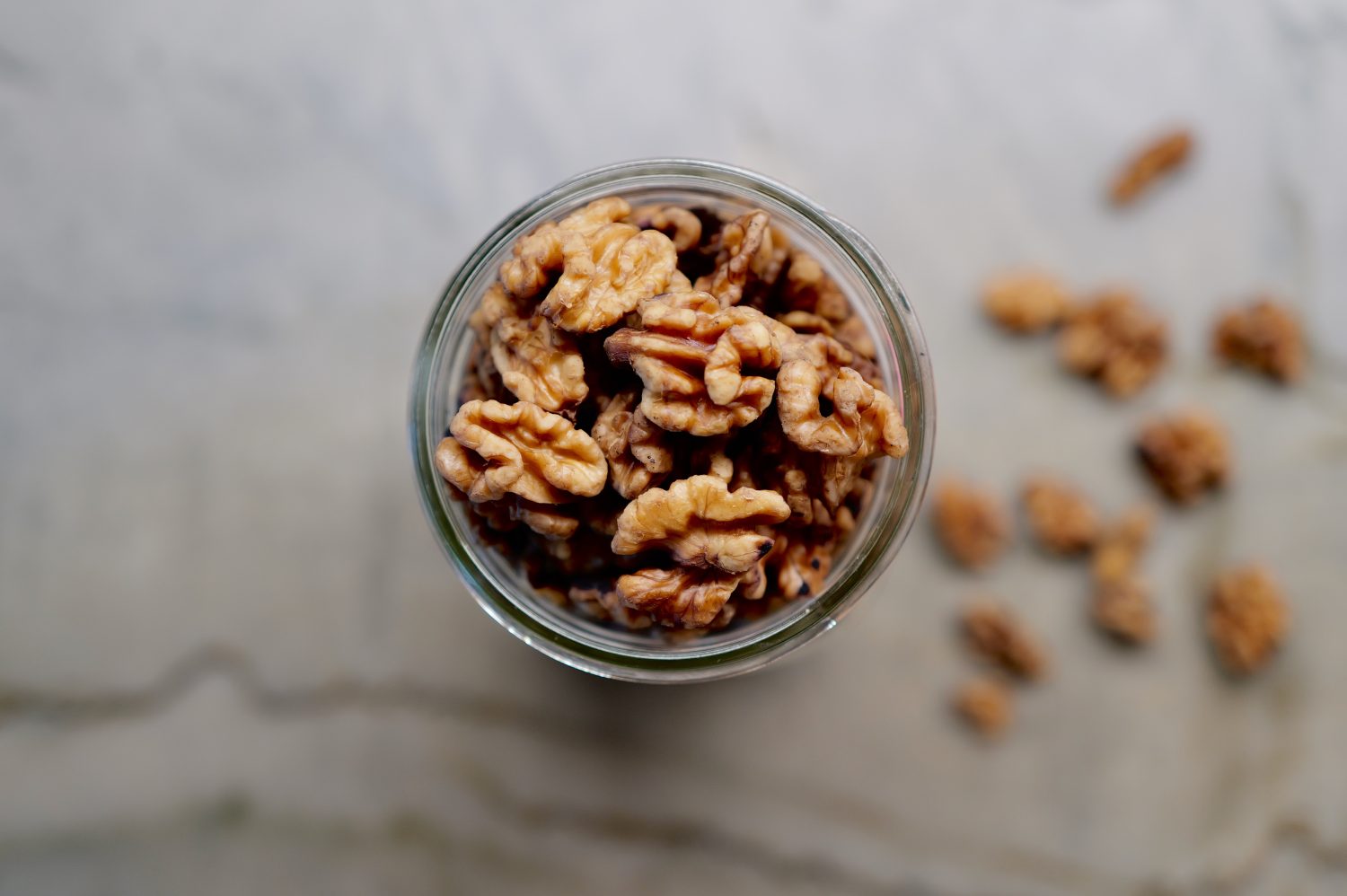 sprouted walnuts in glass jar