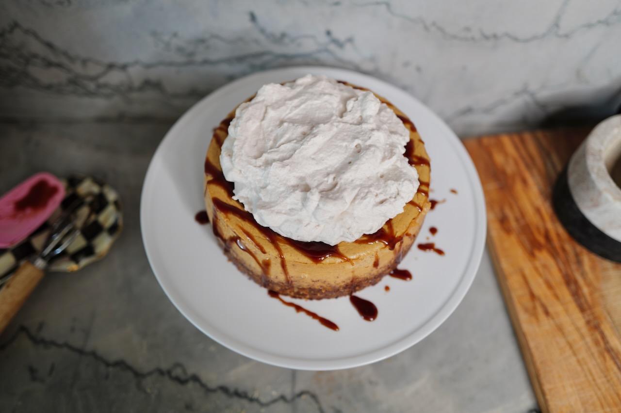 pumpkin cheesecake on cake stand