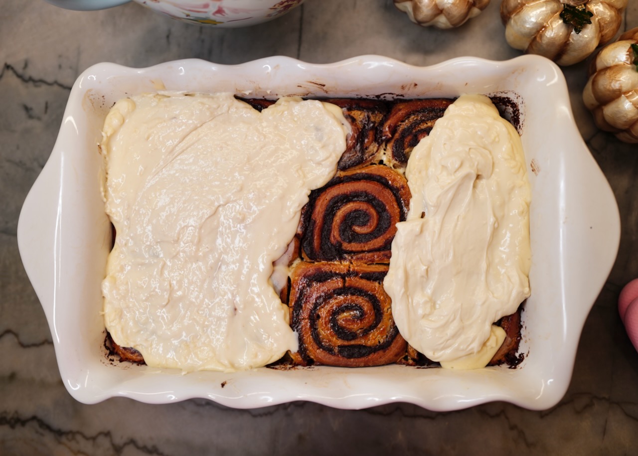 sourdough pumpkin cinnamon rolls in white baking dish