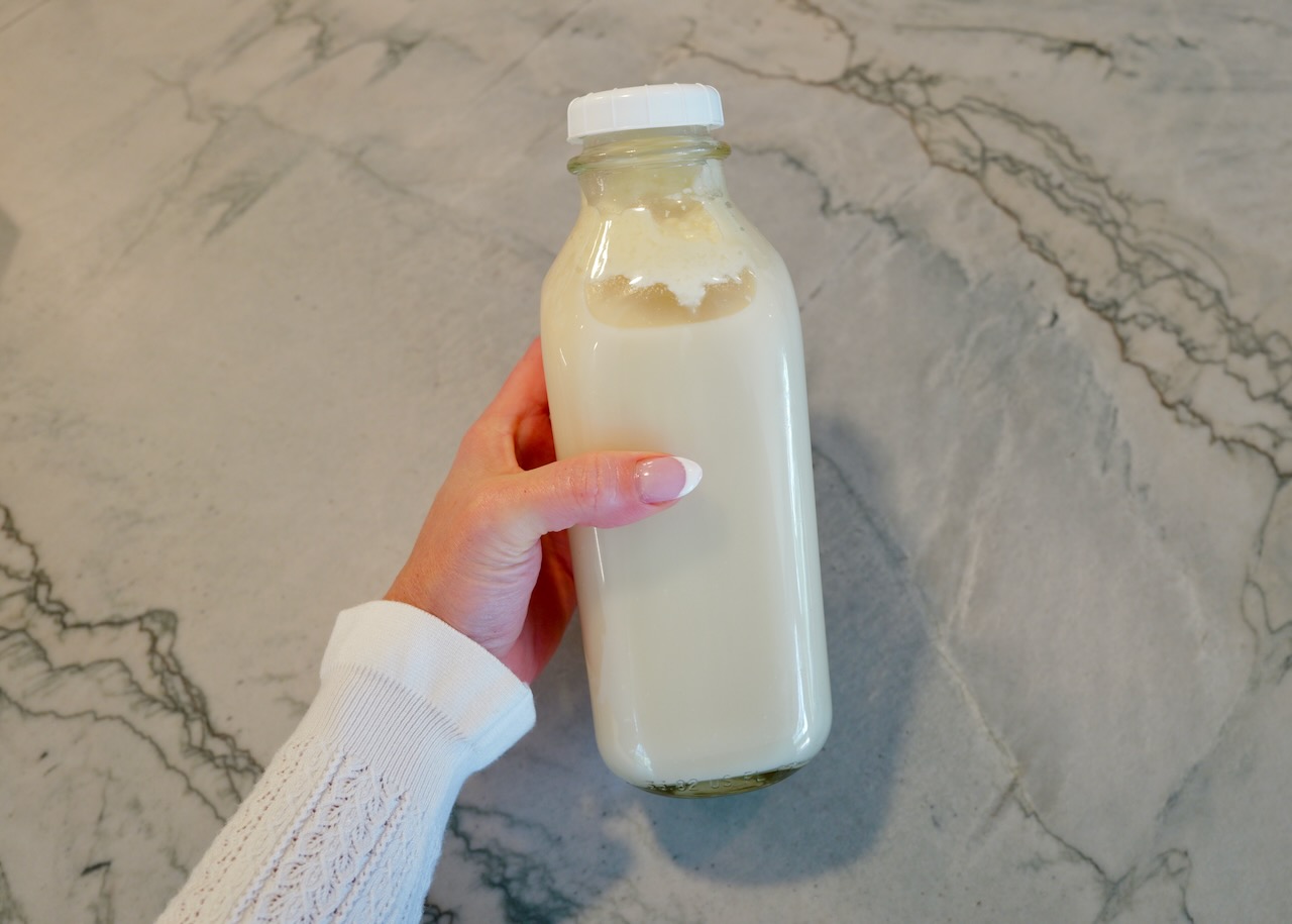 homemade coconut milk in glass bottle