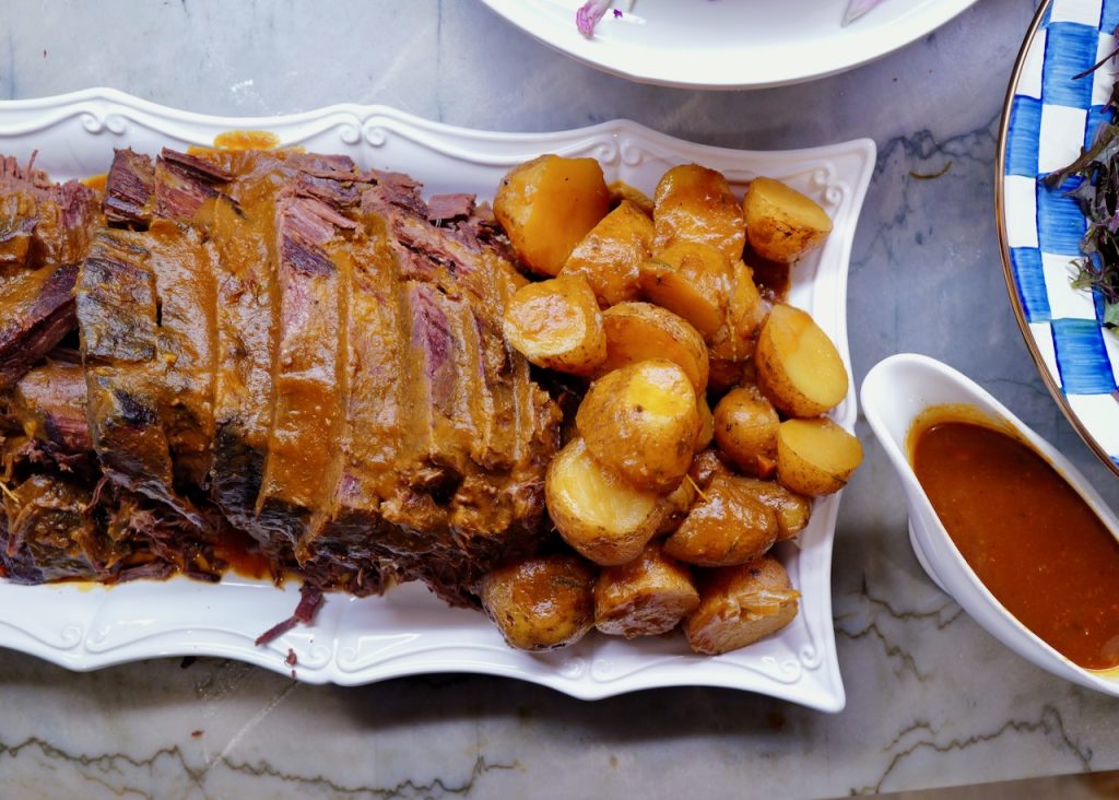 beef pot roast with gravy with baked potatoes