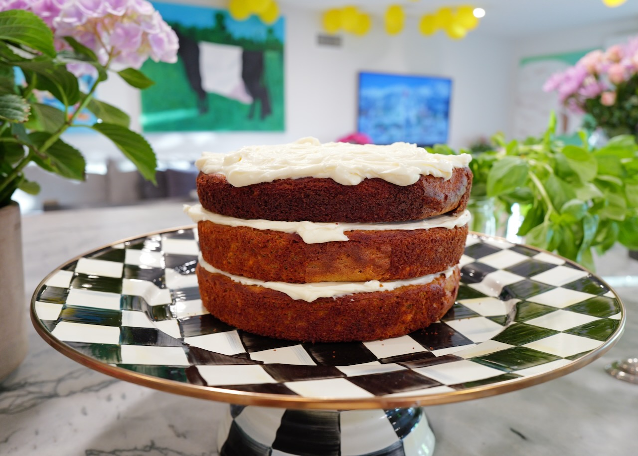triple layer carrot cake on checkered cake stand