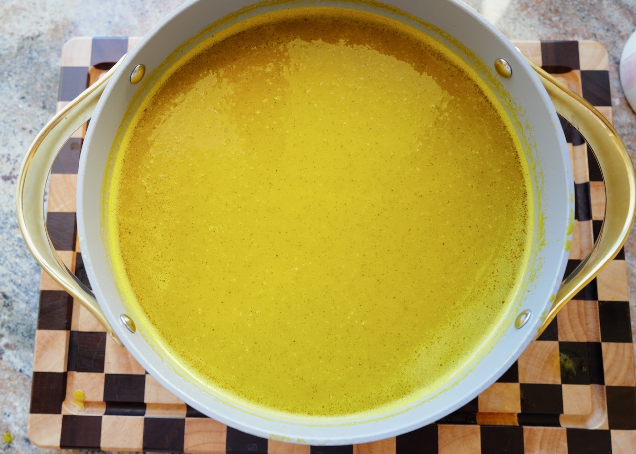 huge pot of homemade pumpkin soup with chicken broth