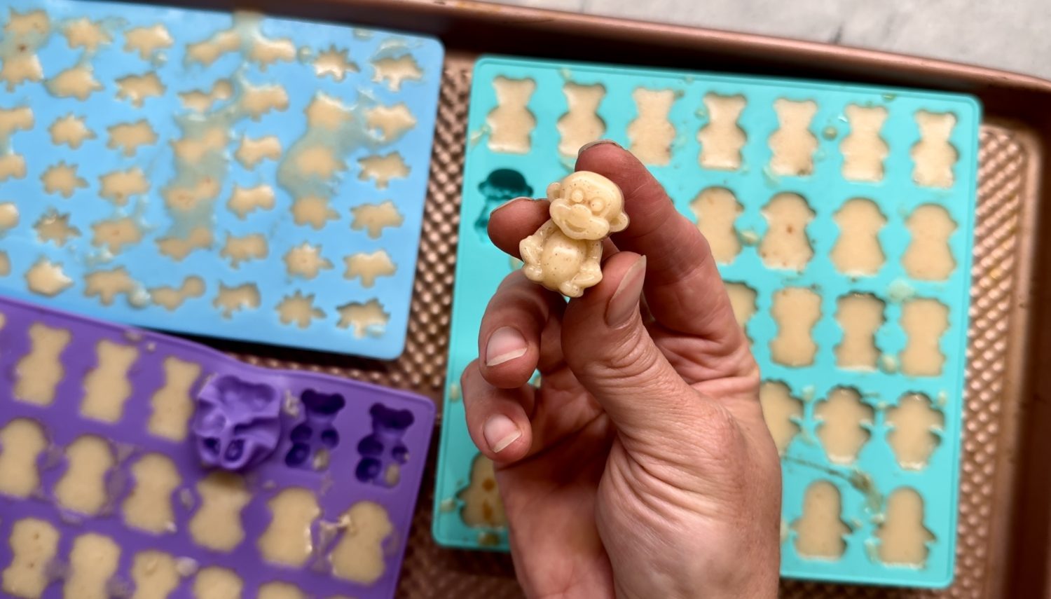 making homemade apple pie gummies with apple and gelatin in silicone molds