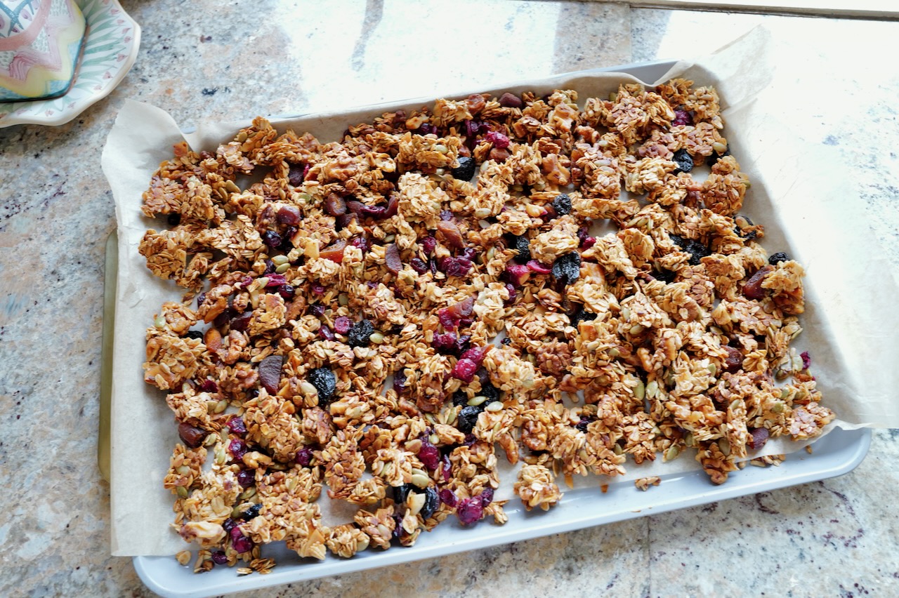 healthy homemade granola on baking sheet - gretchy recipes